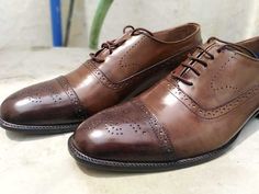 Handmade men's brown leather bespoke style oxfords cap toe lace up shoes 1. Baseline leather sole. 2. 100% Leather heel made. 3. Best finishing brown leather. 4. Manufacture used laceup fastening. 5. Best lining with leather on shoes. 6. Leather sole is inserted in the inner side. 7. Upper side is made by original leather. 8. 100% satisfaction guaranteed. Brown Brogues, Oxfords Shoes, Bespoke Fashion, Leather Brogues, Leather Oxford Shoes, Mens Oxfords, Up Shoes, Lace Up Shoes, On Shoes