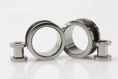 three stainless steel rings with spacers on white background