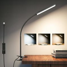 a desk lamp sitting on top of a wooden table