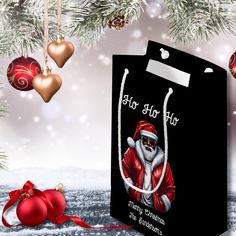 a black shopping bag with santa clause on it and christmas ornaments hanging from the tree