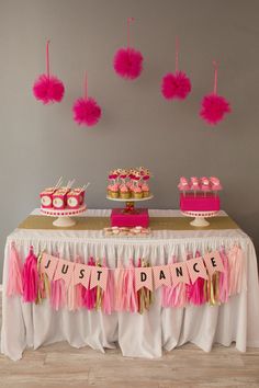 pink and gold dessert table with cupcakes, cake and bunting banner for just dance