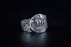 * Viking Longship Ring with Wolf Ornament * ★ SIZE and WEIGHT ★ This ring can be made almost in any size you need, just check options. Weight - 9-10 grams approximately This ring (and all our other jewelry) we make to order only, so it means that you will receive the item, which will be made especially for you! This ring made of 925 silver with dark grey (or light black) patina. If you need it without patina - just silver - please send me a direct request. This ring comes with a beautiful brande Viking Style Engraved Ring Jewelry, Handmade Viking Style Ring Jewelry, Viking Style Engraved Ring, Handmade Viking Ring As A Gift, Handmade Viking Style Ring As Gift, Handmade Viking Style Ring For Gift, Adjustable Viking Style Sterling Silver Jewelry, Viking Style Sterling Silver Ring, Handmade Viking Style Sterling Silver Jewelry