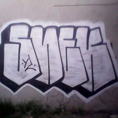 graffiti on the side of a building with black and white letters that spell out eff