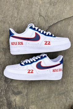 Custom hand-painted sneakers inspired by the Philadelphia 76ers, featuring bold red and blue accents with '22' and 'Sixers' details and red rhinestones around the swooshes #76ers #CustomSneakers #PhillySports