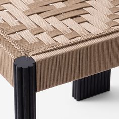 a close up of a bench made out of woven material