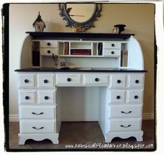 a white desk with drawers and a mirror above it