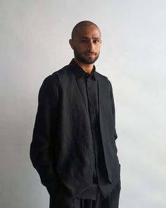 Mens shirt / Mens black long sleeve Linen dress shirt with a built-in Vest by NARGASSI has a regular yet a bit loose fitting silhouette through the body, crafted in a high quality Linen fabric, the black dress shirt features a unique high collar, classic button through placket with matching black buttons and a rounded hem, and classic buttons for the Vest.*** Please note, the model is wearing a shirt without buttons on the Vest, you can choose to have the Vest with or without buttons.Please upda Black Slim Fit Long Sleeve Outerwear, Business Outerwear For Summer With Long Sleeves, Long Sleeve Summer Business Outerwear, Summer Business Outerwear With Long Sleeves, Black Long Sleeve Dress Shirt For Spring, Black Long Sleeve Dress Shirt For Summer, Black Long Sleeve Summer Dress Shirt, Black Shirt With Lapel Collar For Fall, Formal Long Sleeve Summer Outerwear