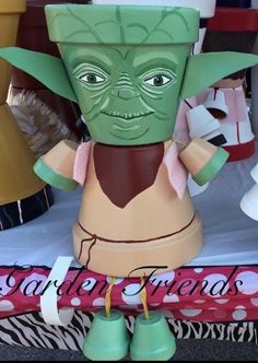 a star wars yoda planter sitting on top of a table