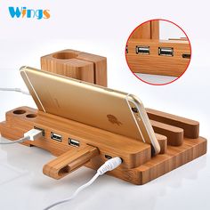 an iphone charging station with two usbs and a wooden holder for the apple phone