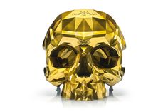 a golden crystal skull on a white background