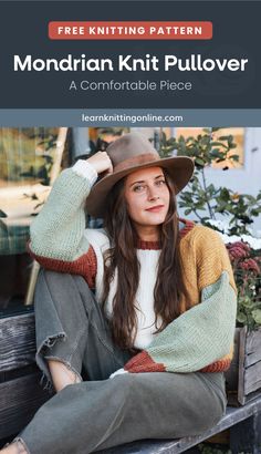 a woman wearing a hat and sweater sitting on a bench with her hands behind her head