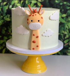 a cake with a giraffe decoration on it