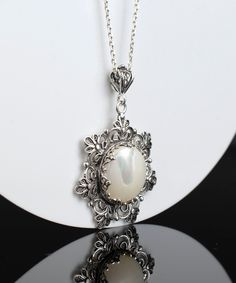 "This beautifully handcrafted filigree art daisy flower pendant feature with Mother of Pearl gemstone. Exquisitely crafted, handmade daisy flower pendant necklace would be your perfect option for anniversary, birthday, thanksgiving or Christmas gift for yourself or loved one.  For gold plated option, visit that link; https://www.etsy.com/FiligranUSA/listing/1401924202 The optional silver chain length is 18.00\" (45.7 cm)  + 2.00\" (5.10 cm) extension.  The Mother of Pearl gemstone diameter is 16 mm, cabochon round-cut.  This metal embroidery filigree pendant is oxidized and highly polished. Comes with a velvet pouch, silver polish cloth and a luxurious gift box. What is Filigree Art? Filigree is made of delicate metal strands that have been skillfully fashioned to create an outstanding com Metal Embroidery, Filigree Pendant Necklace, Birthday Thanksgiving, Silver Polish, Pretty Pendant, Filigree Pendant, Art Pendant, Boho Pendant, Flower Pendant Necklace