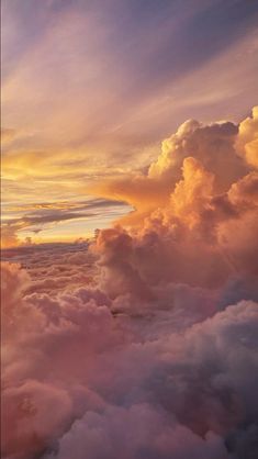 the sky is filled with clouds as the sun sets over the horizon in this photo