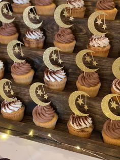 cupcakes with chocolate frosting and stars on them