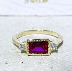 Don't miss this opportunity to own this beautiful gemstone ring crafted in 14k gold filled => Gemstone Type - Lab Grown Ruby, Clear Quartz => Gemstone Size - 5*7 mm, 2.25 mm => Gemstone Cut - Faceted => Metal Type - 14k Gold Filled (Tarnish Resistant And Nickel Free) - also available in 925 sterling silver ~ Please contact me for pricing on a sizes larger than 11 * ~Feel free to ask me about custom made designs. ❏ Replacements and custom orders : ✪ 925 sterling silver - no additional cost ✪ 14k Ruby Ring With Rectangular Stone For Anniversary, Fine Jewelry Ruby Rings With Rectangular Stone, Fine Jewelry Ruby Ring With Rectangular Stone, Rectangular Birthstone Ring For Wedding, Rectangular Birthstone Wedding Ring, Anniversary Birthstone Ring Rectangular, Ruby Rings With Rectangular Gemstone, Ruby Gemstone Rings With Rectangular Stone, Ruby Rings With Rectangular Stone For Wedding