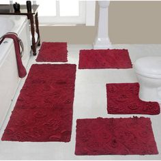 red bathroom rugs and bath mats on the floor