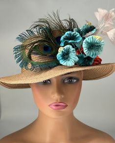 The hat featured here is a tan straw hat with a small brim and a beautiful   peacock feather design. Next to that are teal velvet flowers, an orange satin flower and a plumevif baby pink feathers. This is a one of a kind  hat  made by Letty. Creating the look that suits you best can be achieved just by  turning the hat on your head creating a different look with each twist till you find the look you love.. This gorgeous  hat is a beautiful Church hat or a Kentucky Derby Hat.  Also perfect  for  an Easter Hat, Tea Party hat, Wedding Party Hat, Fancy Dress Hat, Retro Hat and other special occasions hat. Brim:   2" Rise:   4" Size:    22" Bohemian Straw Hat For Kentucky Derby, Kentucky Derby Bohemian Straw Hat With Curved Brim, Beige Summer Fascinator For Garden Party, Bohemian Straw Hat With Short Brim For Garden Party, Beach Hats With Feathers And Wide Brim, Bohemian Fedora Straw Hat For Garden Party, Summer Short Brim Fascinator For Garden Party, Wide Brim Beach Hat With Feathers, Whimsical Beach Headpieces For Summer