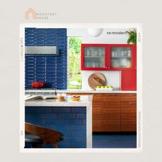 an image of a kitchen with blue and red cabinets on the counter top in front of a window