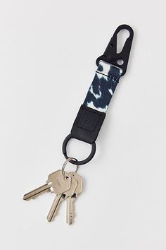 a keychain with two keys attached to it