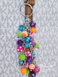 a keychain with lots of colorful beads on it