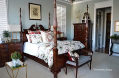 a bedroom with four poster bed, dresser and chair