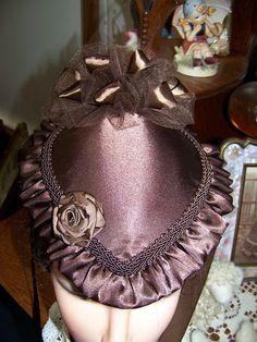 "You are purchasing a Victorian ladies Civil War Hat or purse also great for Civil War reenactors or Dickens's Christmas events. The Hat measures 9\" front-back 8\" side to side and 5\" tall with puff in the back. The hat is trimmed with black satin and braid. The ribbons are black satin and the Bow in the back is black tulle with black satin ribbon mixed in. The fabric is satin and it is fully lined. The embellishment on the front is black satin ribbon rose. I can make this item in many other f Missions Conference, Victorian Dress Gown, Rose Costume, Diy Hats, Satin Ribbon Roses, Victorian Hats, Victorian Ladies, Ladies Hat, Antique Hats