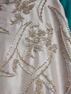 the back of a dress with beading on it