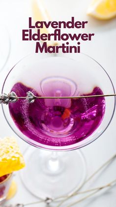 a close up of a wine glass on a table with lemons and other items