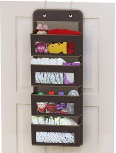 an over the door hanging organizer holds diapers and baby goods in it's holder