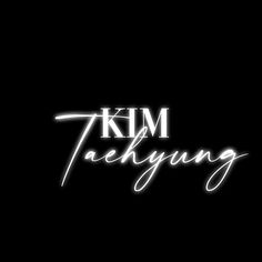 the words kim taehyng written in white on a black background with an orange light