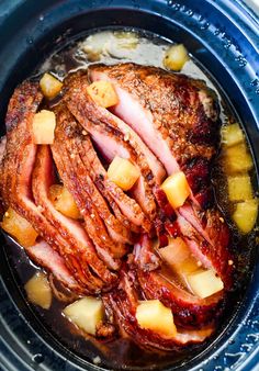 ham and pineapples are cooked in the slow cooker to make an entree