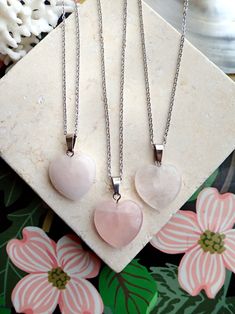 A genuine polished rose quartz heart - shaped crystal is strung on your choice of chain. This healing crystal makes a great gift for all those working on their heart chakra and is a sweet addition to anyones necklace arsenal. Metaphysical Properties:Rose quartz is known as a healing crystal and the stone of unconditional love. It's believed by some to emit strong vibrations of love, which are thought to: support emotional and relationship healing. inspire compassion. boost feelings of peace and Rose Quartz Crystal Necklace As Gift, Spiritual Crystal Necklace With Heart Beads As Gift, Spiritual Crystal Necklace With Heart Beads For Gifts, Heart-shaped Spiritual Crystal Necklaces For Healing, Spiritual Crystal Necklace With Heart Charm, Heart-shaped Crystal Necklace With Natural Stones For Healing, Heart-shaped Natural Stone Crystal Necklace For Healing, Rose Quartz Gemstone Necklace For Valentine's Day, Spiritual Pendant Crystal Necklace For Valentine's Day