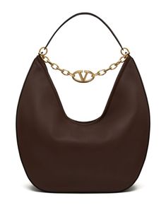 Find VALENTINO Vlogo Moon Shoulder Bag on Editorialist. The Valentino Garavani VLogo Moon Shoulder Bag is crafted from lambskin leather with a smoothing finish. It features a gold-tone logo plaque and a signature VLogo. The bag has a top zip fastening and a chain-link shoulder strap. Elegant Brown Shoulder Bag With Metal Logo, Luxury Brown Shoulder Bag With Metal Logo, Luxury Brown Bag With Metal Logo, Chic Brown Bags With Metal Logo, Moon Shoulder Bag, Valentino Garavani Bag, Moon Bag, V Logo, Shoulder Bag Brown