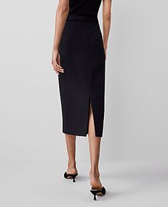 Elevate your wardrobe with the Ann Taylor Ponte Belted Midi Pencil Skirt, a piece that marries sophistication with comfort. This skirt is designed to flatter, featuring a sleek midi length and a streamlined silhouette that enhances your figure.

- Size: Regular - 6
- Color: Black
- Gender: Female
- Material: 66% Rayon, 30% Nylon, 4% Spandex
- Length: 32" long
- Features: Belt loops, self-tie buckle belt, hidden back zipper with hook-and-eye closure, back vent

Perfect for both office and evening Fitted Belted Midi Bottoms, Fitted Midi Length Belted Bottoms, Chic Pencil Skirt With Belt Loops For Work, Chic Pencil Skirt With Belt Loops, Chic Workwear Pencil Skirt With Belt Loops, Fitted Pencil Skirt With Belt Loops For Workwear, Workwear Pencil Skirt With Belt Loops, Office Pencil Skirt With Belt Loops, Minimalist Chic Fashion