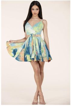 Tie-Dye Mini Dress features a surplice neckline and a flirty skater silhouette with a godet mini hem featuring a removable belt. -Enclosed Side Zipper -Adjustable Straps -Removable belt -100% Cotton, Contrast : 100% Cotton, Lining : 97% Polyester 3% Spandex Fitted Mini Dress With Belt For Summer, Summer Mini Dress With Belt, Spring V-neck Belted Mini Dress, Belted Mini Dress For Summer, Summer V-neck Belted Mini Dress, Belted Multicolor Mini Dress For Summer, Belted Blue Mini Dress For Summer, Blue Belted Mini Dress For Summer, V-neck Belted Mini Dress For Day Out