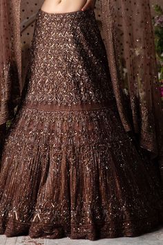 Brown lehenga with all over sequins ,cutdana, zari beaded embroidery. Comes with a blouse with Swarovski, zari, cutdana and sequins embellishments and net dupatta.
Component: 3
Embroidered
Neckline: Sweetheart
Sleeve Length: Elbow
Fabric: Net
Color: Brown
Fit and flared lehenga
Swarovski embrodiery
All over embroidery on lehenga and blouse - Aza Fashions Brown Lehenga, Flared Lehenga, Desi Clothing, Lehenga And Blouse, Net Embroidery, Brown Fits, Net Dupatta, Embroidered Neckline, Wedding Outfits