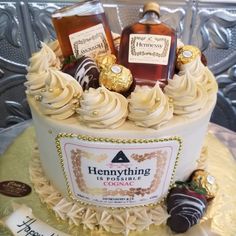 a cake decorated with chocolates, candies and bottles of liquor on top of it