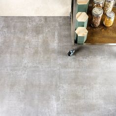 an overhead view of a kitchen with gray carpet