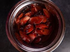 a jar filled with sliced up carrots on top of a table