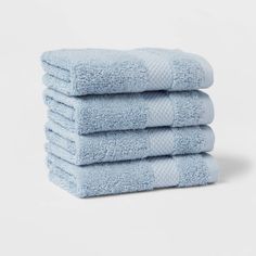 five blue towels stacked on top of each other