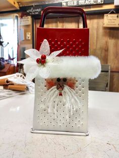 a bag with a santa clause on it sitting on top of a table