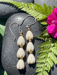 Pikake Dangle Earring with gold beads. Depth of color of beads may vary. Please note size comparison in the photo with quarter. Elegant Gold Flower Earrings With Dangling Beads, Gold Beaded Long Drop Earrings, Gold Beaded Teardrop Pearl Earrings, Gold Teardrop Earrings With Gold Beads, Bohemian Gold Beaded Pearl Earrings, Nickel-free Cream Dangle Jewelry, Gold Flower Earrings With Dangling Beads As Gift, Bohemian Gold Pearl Earrings With Dangling Beads, Gold Bohemian Pearl Earrings With Dangling Beads