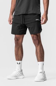 These water-resistant shorts are lightweight, linerless and made of four-way-stretch fabric for effortless movement. A technical front overlay panel partially conceals two vertical zip pockets to securely store your essentials while a handy utility loop holds a towel or shirt. 7" inseam; 22" leg opening; 13 front rise; 15" back rise (size Medium) Drawstring waist Utility loop holds shirt or towel Water resistant 76% nylon; 24% spandex Machine wash, line dry Imported Black Techwear Bottoms For Training, Compressive Outdoor Shorts, Compressive Short Bottoms For Outdoor, Techwear Sports Shorts With Built-in Shorts, Outdoor Compressive 2-in-1 Bottoms, Black Athletic Fit Shorts For Outdoor, Technical 4-way Stretch Black Bottoms, Black Nylon Techwear Shorts, Black Compression Athletic Shorts For Outdoor