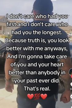 the man is walking down the street with his hand in his pocket and texting that reads, i don't care who had you first and i don't care