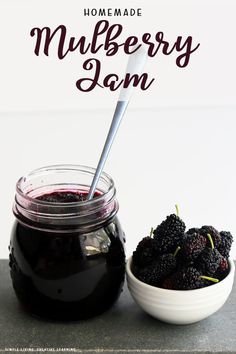 homemade mulbberry jam in a mason jar with fresh blackberries next to it