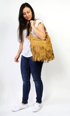 LEATHER FRINGE - leather boho fringe handbag.This hobo is the perfect size to carry your daily essentials in style! It is made from high quality leather.This leather bag can be used as a tote and messenger bag. By using the adjustable leather strap you can convert it into a crossbody bag.This leather bag is a perfect everyday bag! There is a lot of space and you can put there everything in your everyday life.* Lining* An external pocket on the back* Includes internal pockets for mobile phone and Bohemian Fringe Satchel For Daily Use, Daily Use Fringe Satchel Shoulder Bag, Everyday Use Fringe Shoulder Bag, Daily Use Leather Hobo Bag With Fringe, Leather Fringe Hobo Bag For Daily Use, Everyday Bucket Shoulder Bag With Tassels, Fall Fringe Satchel Bag, Bohemian Crossbody Satchel With Fringe, Everyday Crossbody Shoulder Bag With Fringe