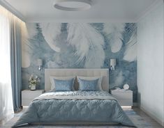 a bedroom with blue and white decor on the walls, carpeted flooring and a large bed