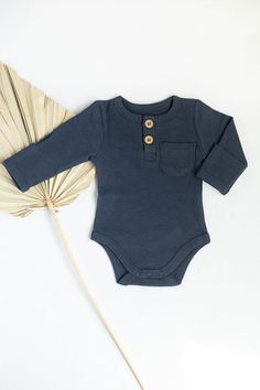 Your baby deserves special clothes, and the soft cotton of our bodysuits feels incredibly comfortable. Ribbed cotton, longer sleeves and a higher neck ensure that your baby is dressed wonderfully. This baby bodysuit has a casual look and provides convenient access to the diaper area. Available in a wide range of colors and made from 60% Cotton and 40% spandex, this design for babies is both innovative and stylish.  select suitable size by age: 0-3month 3-6 month Color Floral Brown Light Green Of Cotton Ribbed Onesie In Solid Color, Solid Color Cotton Ribbed Onesie, Solid Cotton Long Sleeve Bodysuit, Long Sleeve Solid Cotton Bodysuit, Ribbed Cotton Onesie, Solid Long Sleeve Cotton Bodysuit, Unisex Long Sleeve Onesie For Loungewear, Fall Cotton Long Sleeve Bodysuit, Long Sleeve Ribbed Cotton Onesie