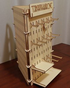 a wooden model of a tower with the word timberland on it's side